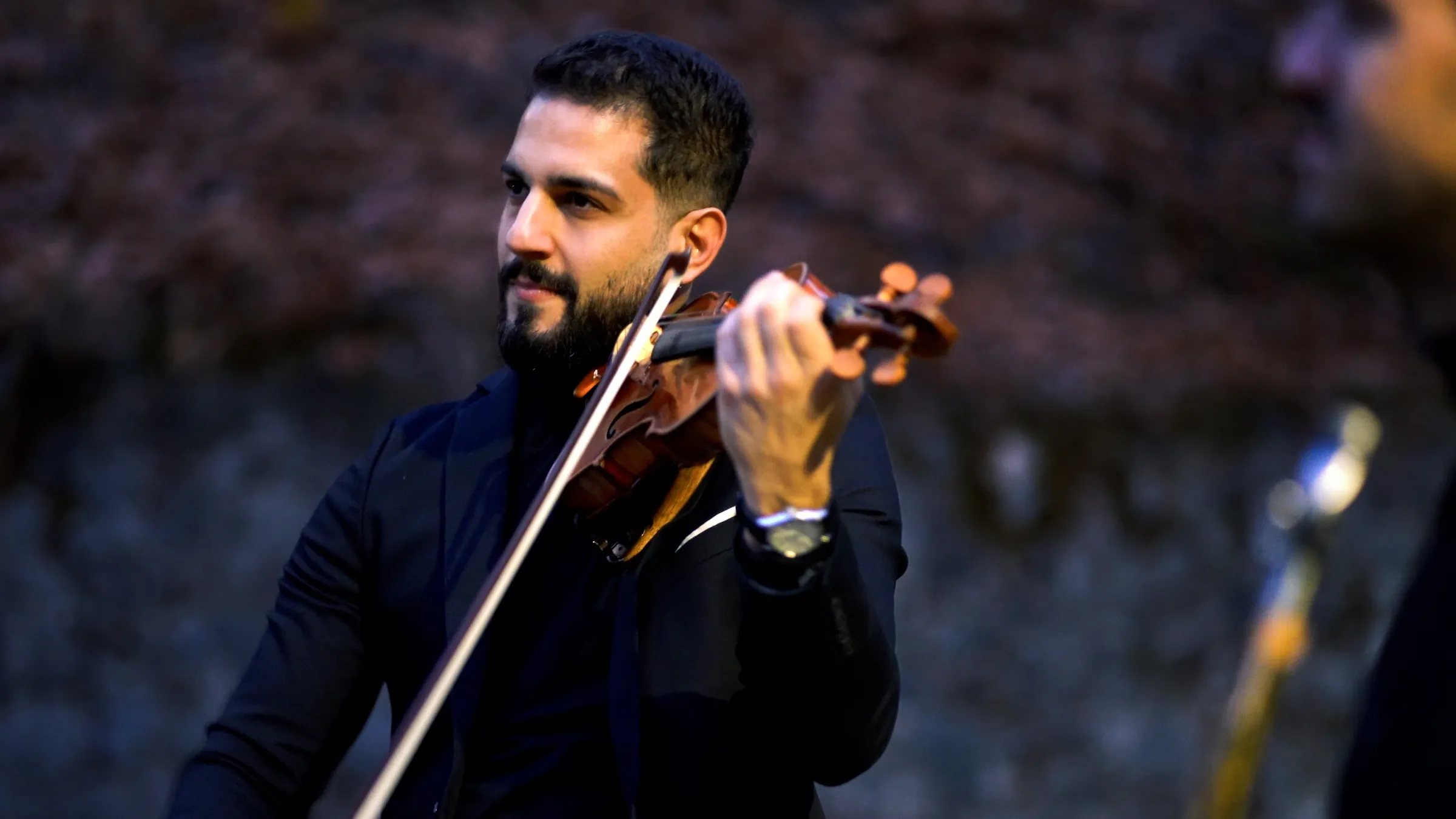 Marios playing violin at dusk