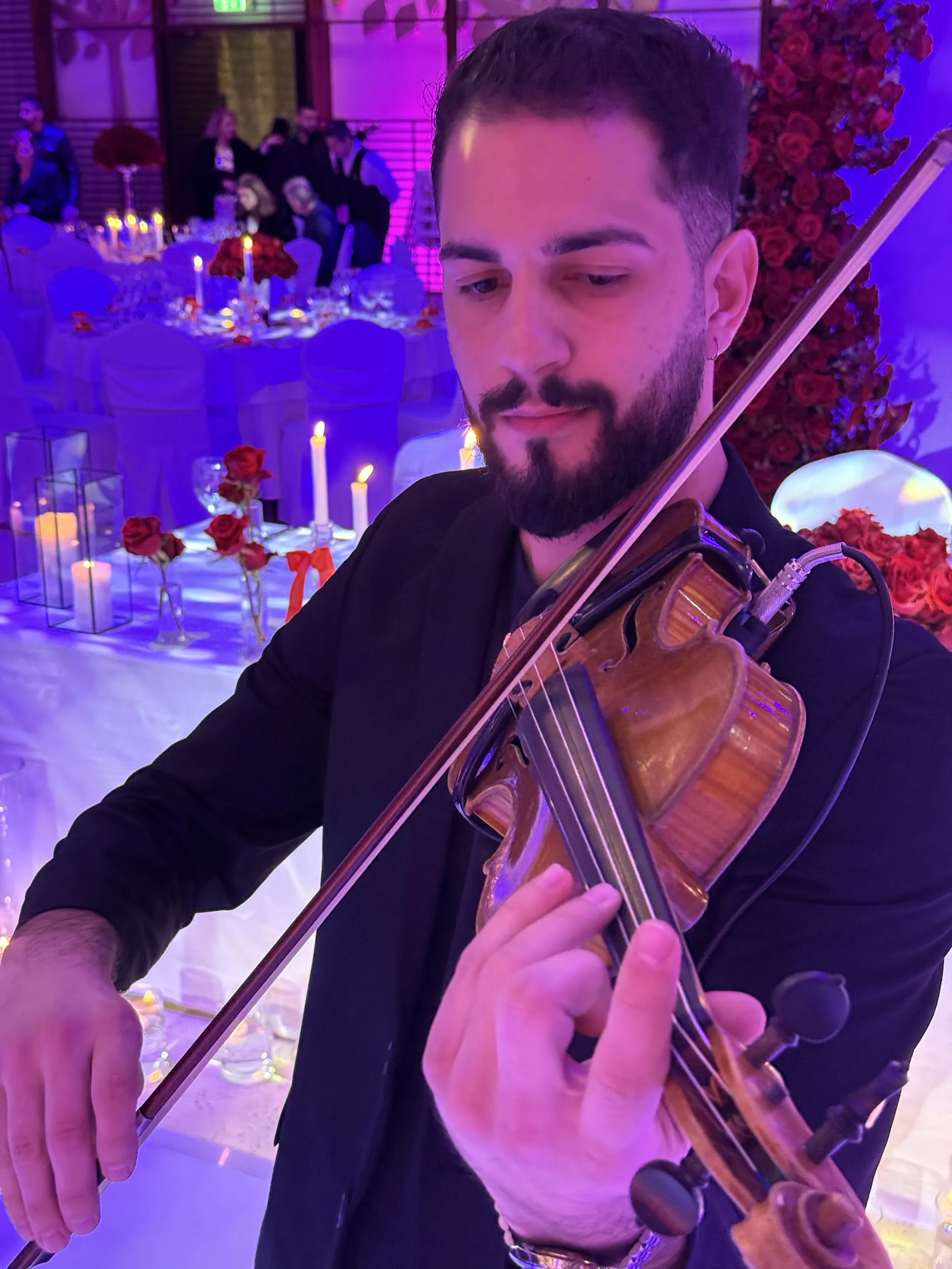 Close portrait of Marios playing at a reception